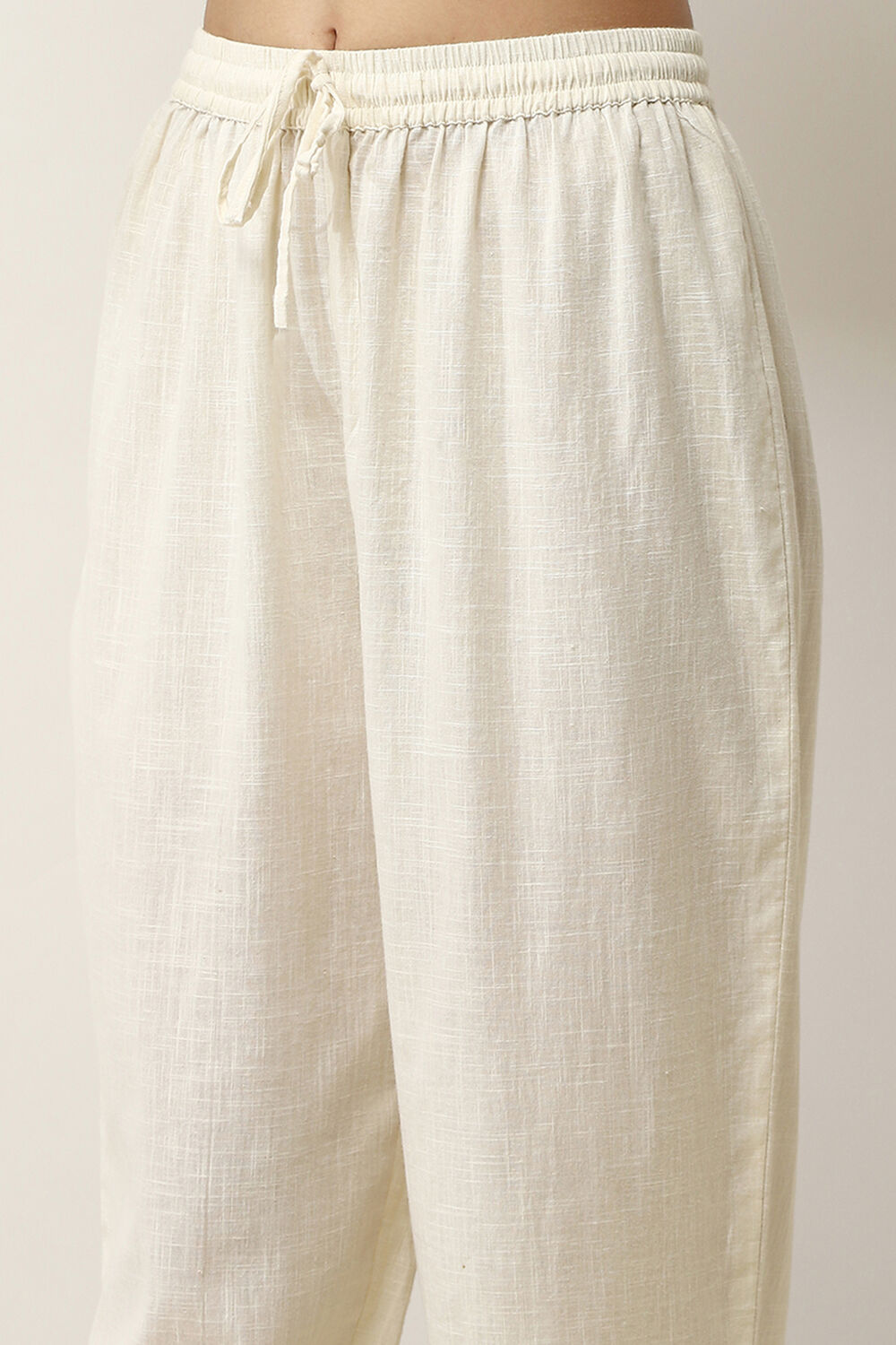 Off-White Cotton Solid Regular Pants image number 1