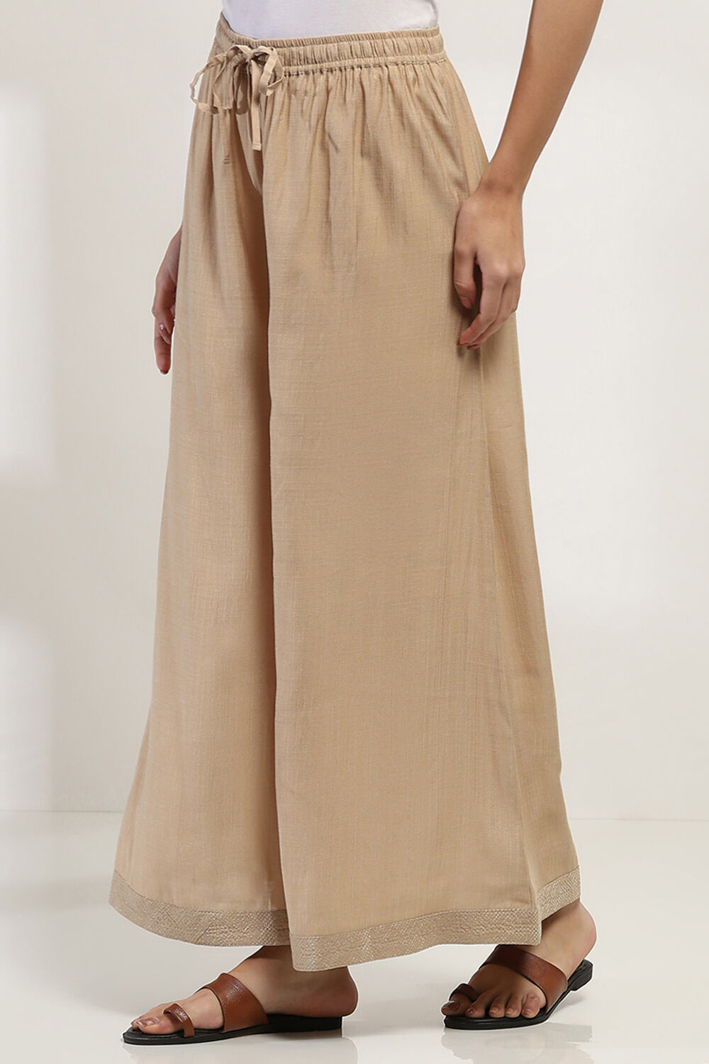 Gold-Toned Solid Flared Palazzos image number 2
